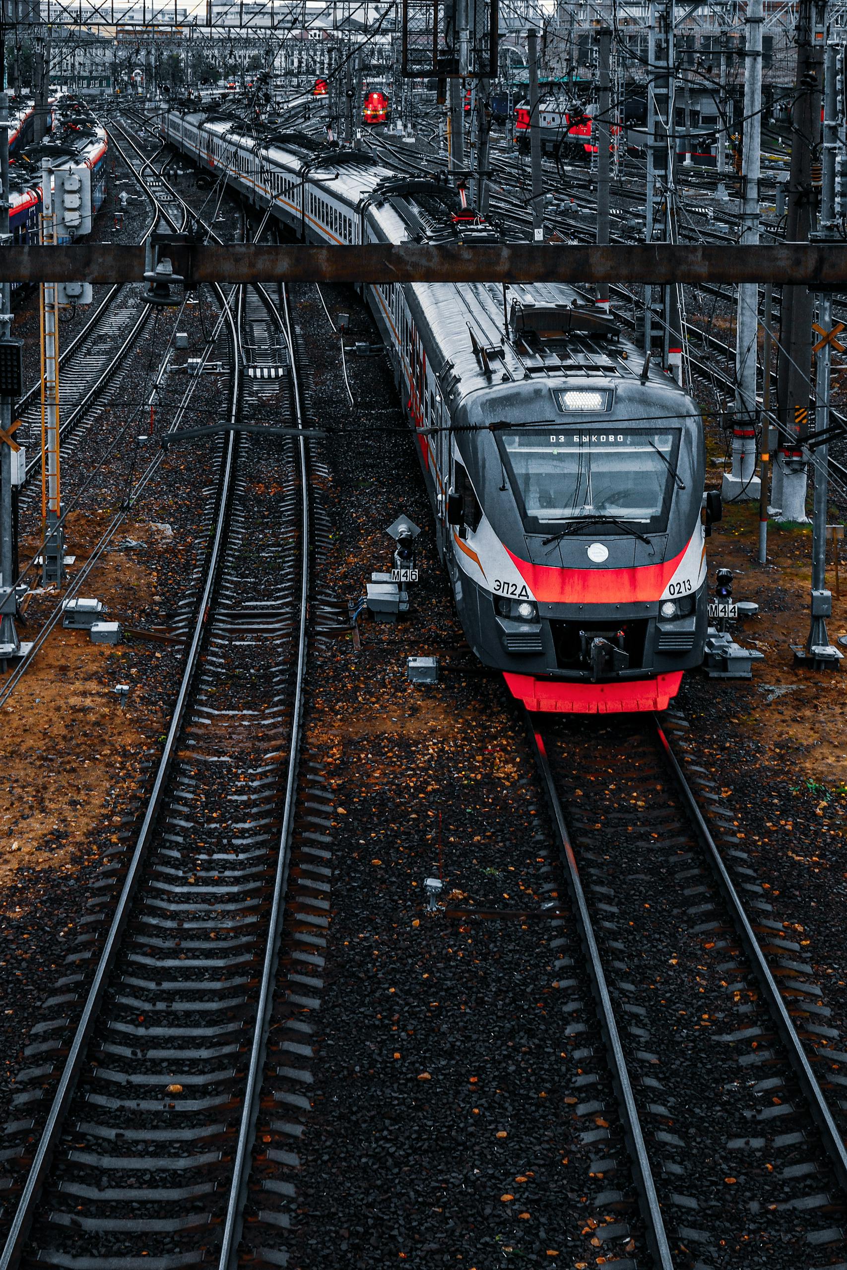 Dynamic shot of a modern passenger train navigating tracks in Moscow.